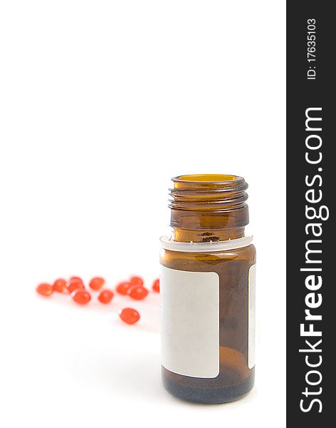 Overturned bottle and vitamins, are isolated on a white background