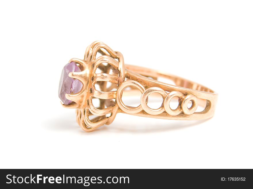 The Golden Ring with amethyst, is isolated on a white background