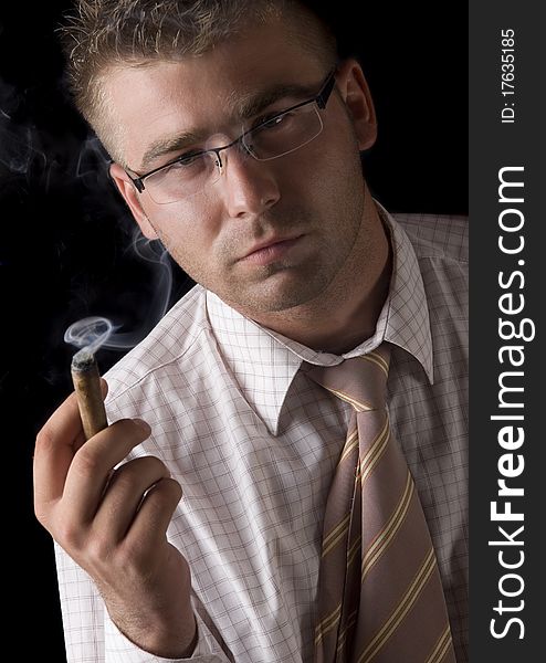 Businessman smoking cigar