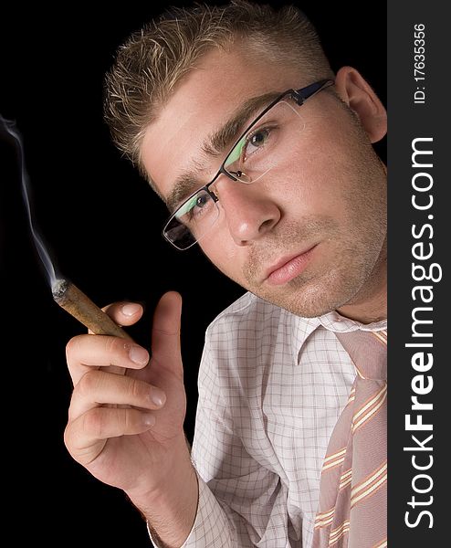 Businessman smoking cigar