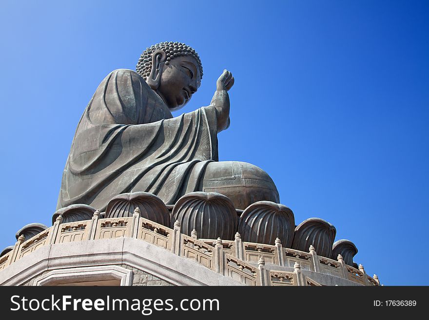 Buddha statue sitting in have no fear mudra on the Lantau island (Hong Kong)