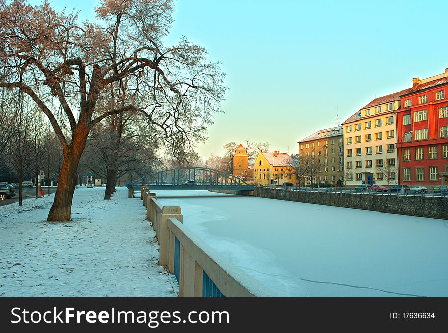 Winter river in historic town. Winter river in historic town