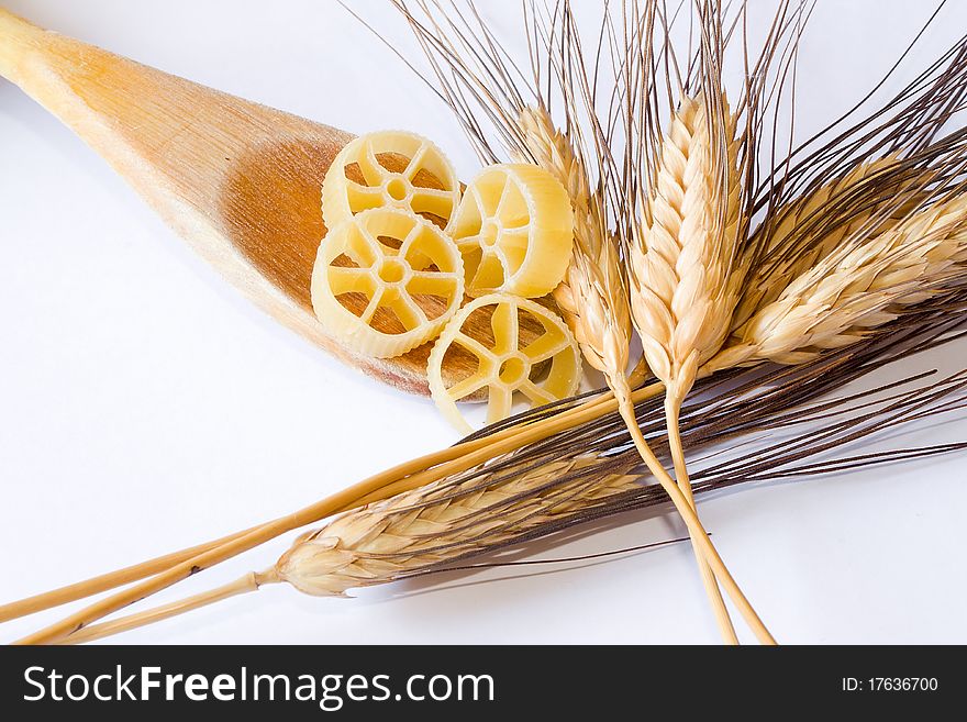 Closeup of italian food and natural spike on white background. Closeup of italian food and natural spike on white background