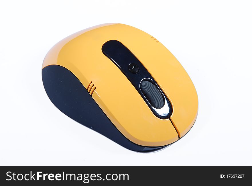 A yellow wireless computer mouse on white background. A yellow wireless computer mouse on white background