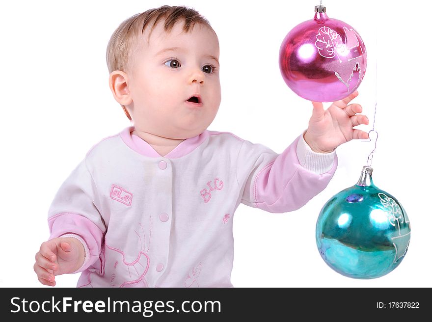 The child lasts hands to a fur-tree toy. The child lasts hands to a fur-tree toy