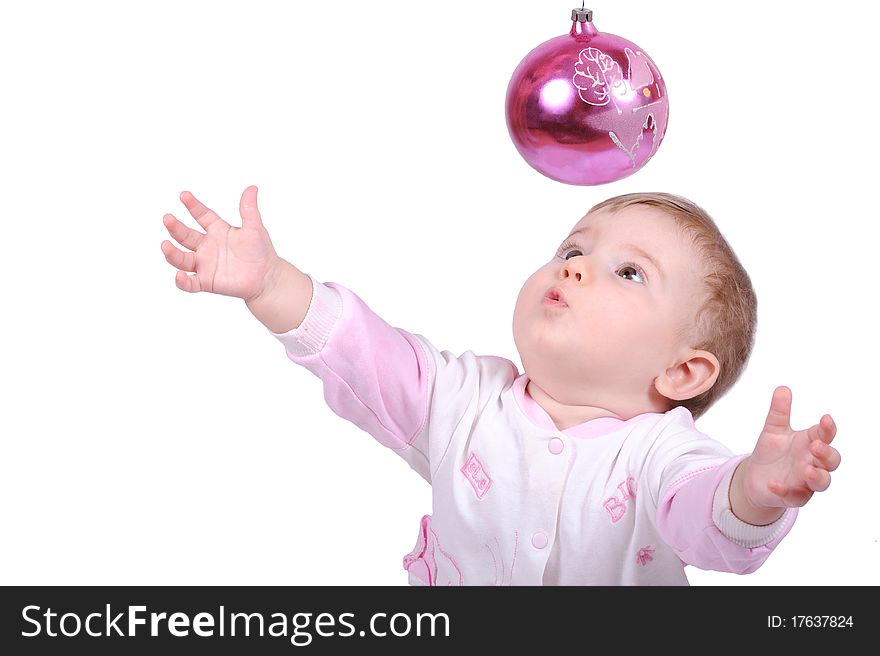 The child lasts hands to a fur-tree toy. The child lasts hands to a fur-tree toy