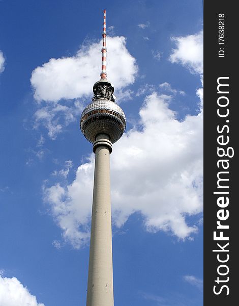 Berlin television tower, Germany. Blue sky with clouds in background.
