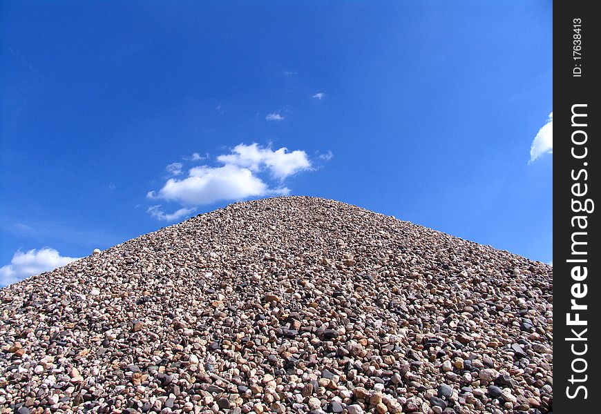 A hill of bright stones looking like a pyramid. A hill of bright stones looking like a pyramid