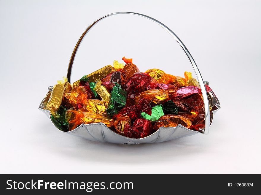 Isolated bowl of assorted chocolate sweets. Isolated bowl of assorted chocolate sweets