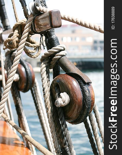 Wooden pulley and ropes of a tall ship