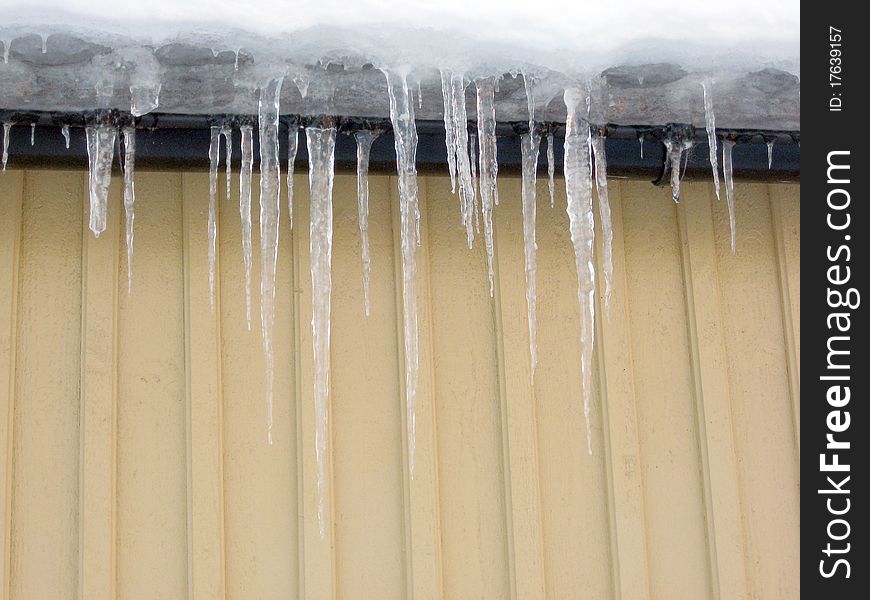 Melting icicles on the roof