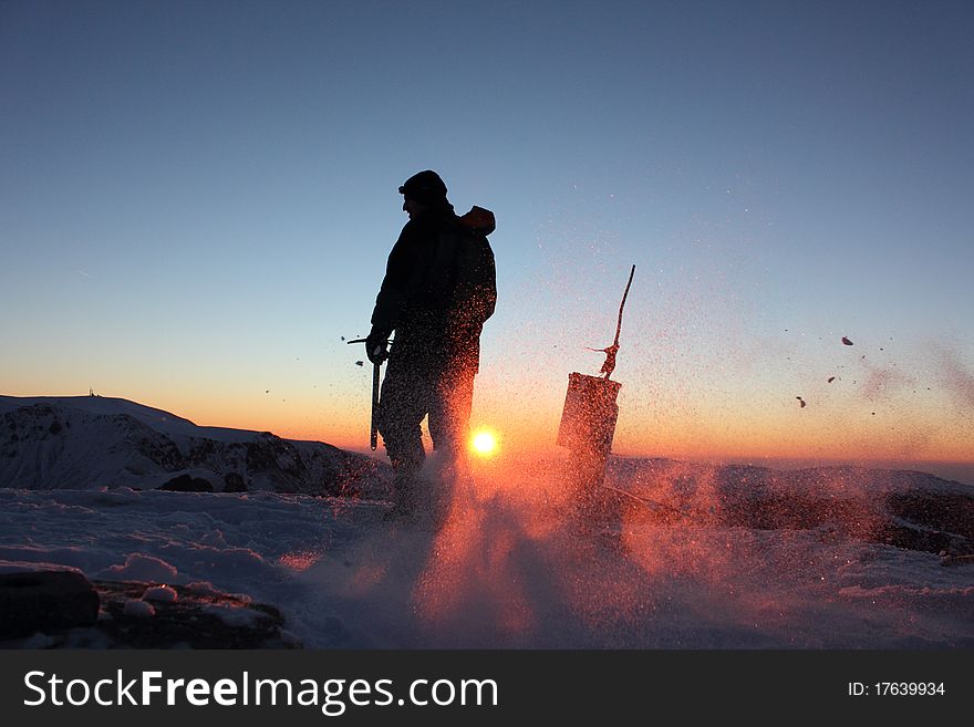 Climber on Mount Kupena - 2169 m altitude in the Central Balkan Mountains in eastern Europe at sunrise