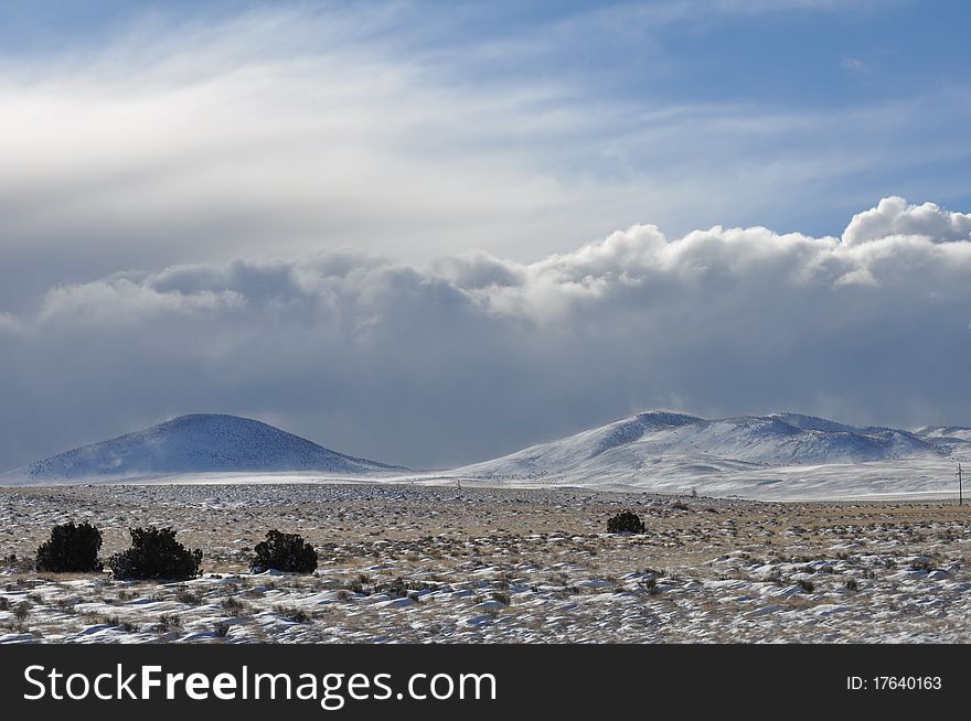 Rolling storm clouds over the desert landscape