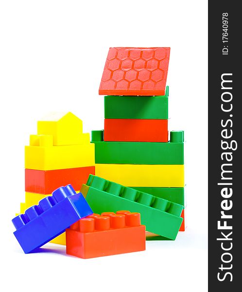 Colorful plastic toys and bricks isolated on white background