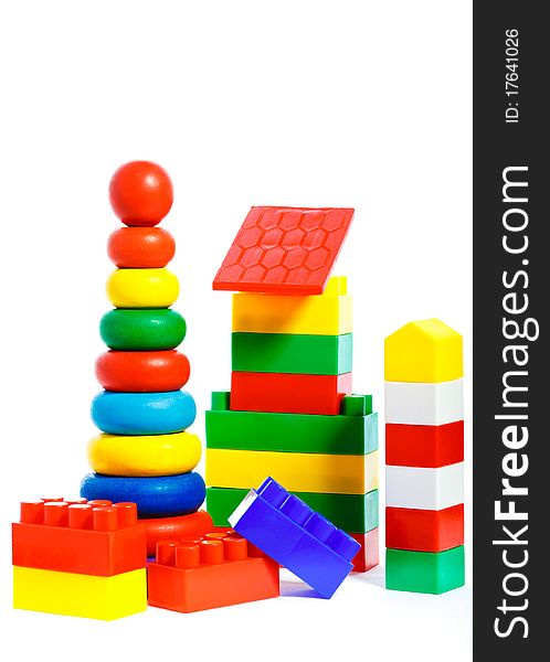Colorful plastic toys and bricks isolated on white background