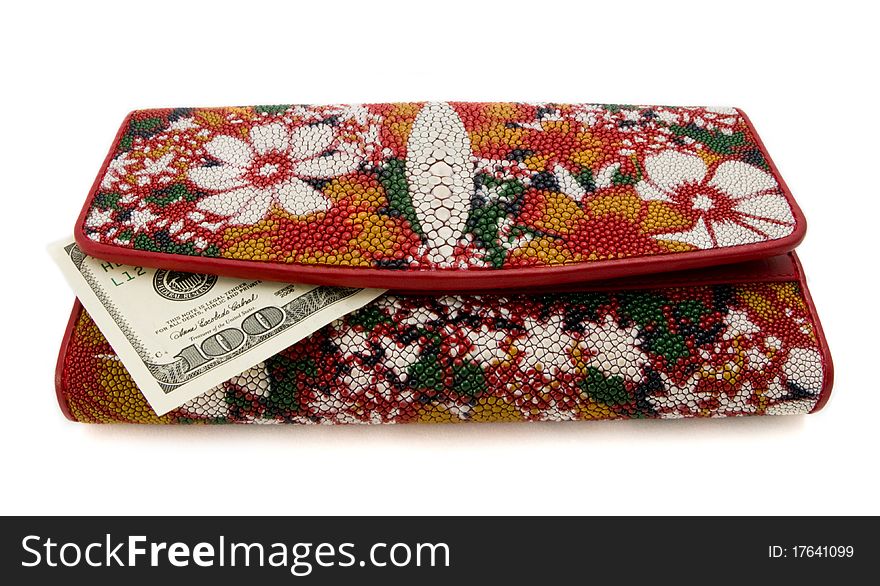 Woman purse with a banknote on a white background