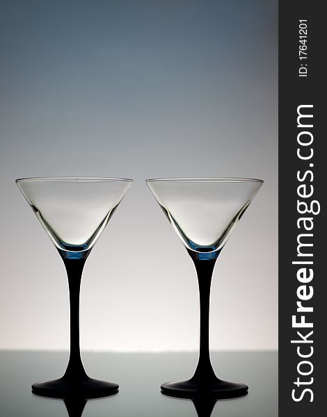 Two Martini Glasses on a gray background
