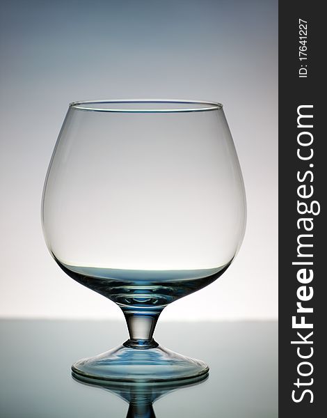 Decorative wineglass on a gray background