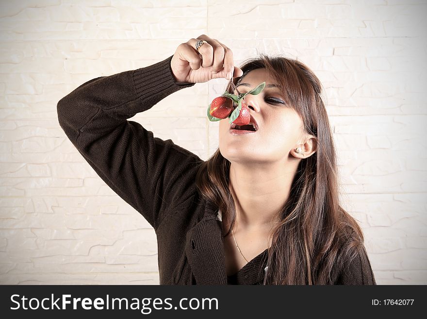 Beautiful girl eating fresh strawberries. Beautiful girl eating fresh strawberries.