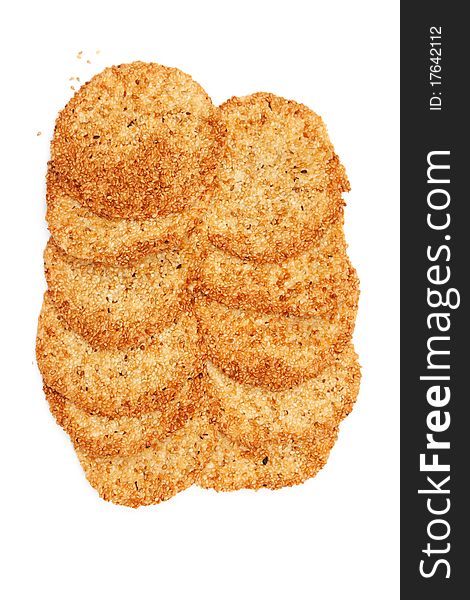 Biscuits with sesame seeds on a white background