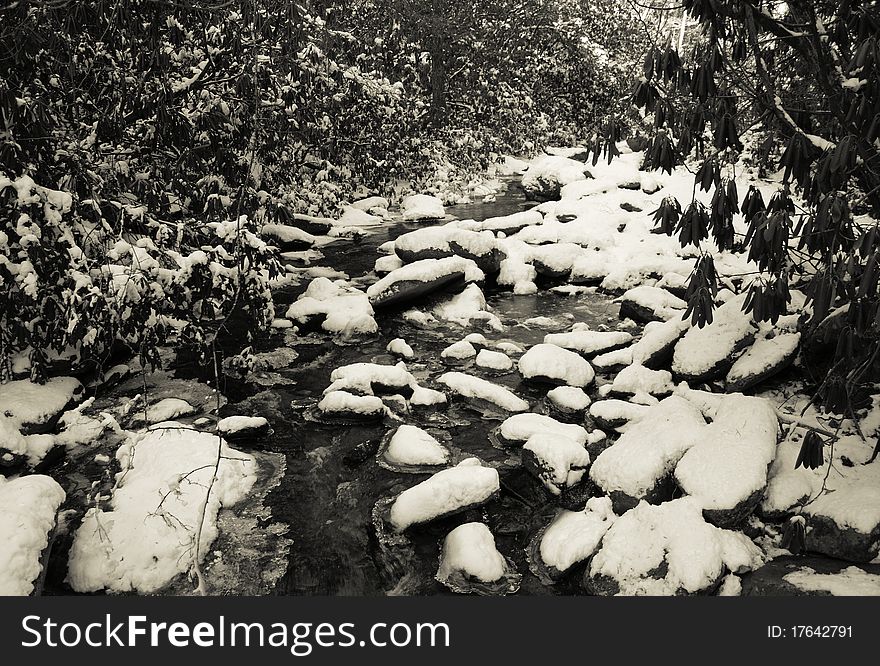 View along the Jacobs Fork River at South Mountain State Park after a snow fall. View along the Jacobs Fork River at South Mountain State Park after a snow fall