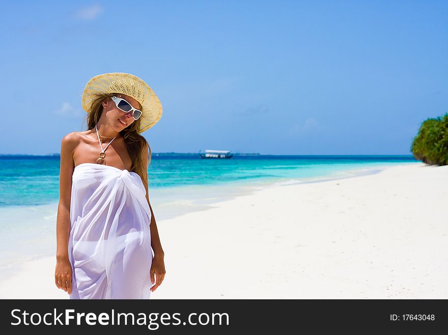 Lady in a bikini on a tropical beach. Lady in a bikini on a tropical beach