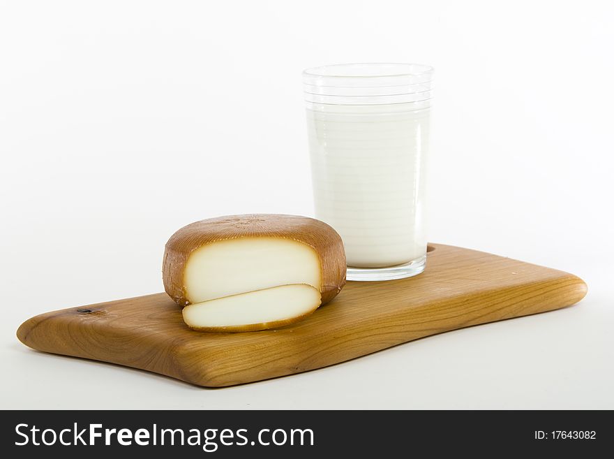 Smoked cheese with glass of milk