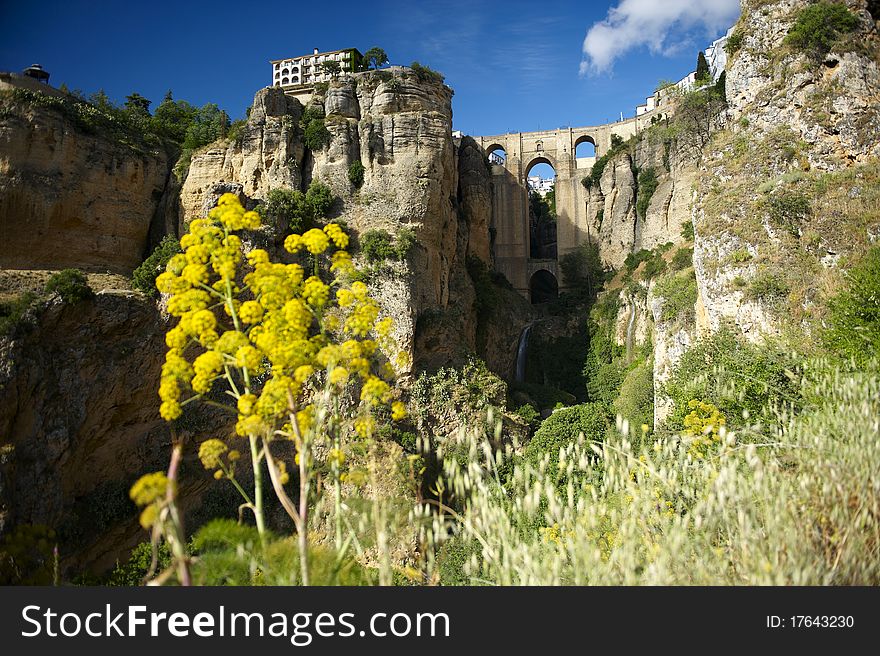 Famous stone bridge which link two sides of Ronda, andalusian city in Spain. Famous stone bridge which link two sides of Ronda, andalusian city in Spain.