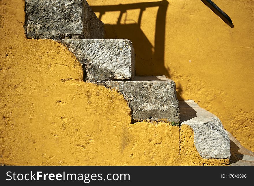 Stairs in yellow wall environment