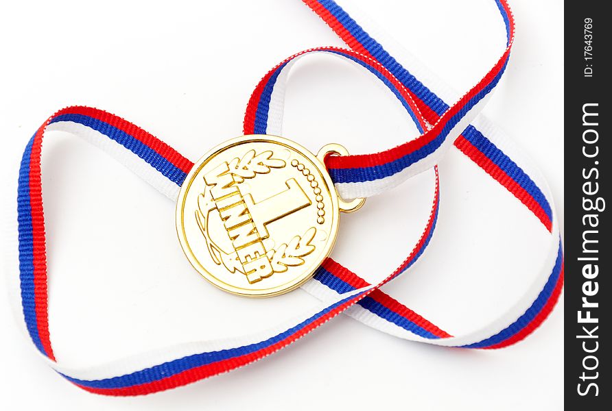 Golden medal and ribbon isolated on white background. Golden medal and ribbon isolated on white background