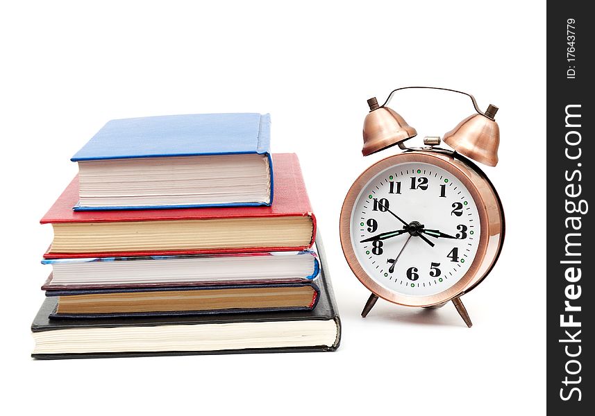 Back to school concept with books and clock