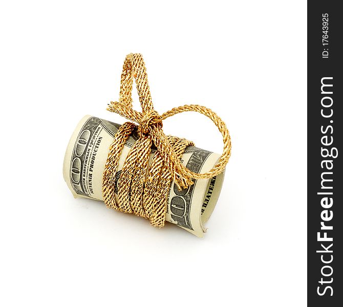 Stack of money tied up with a silver and gold ribbon on a white background. Stack of money tied up with a silver and gold ribbon on a white background.
