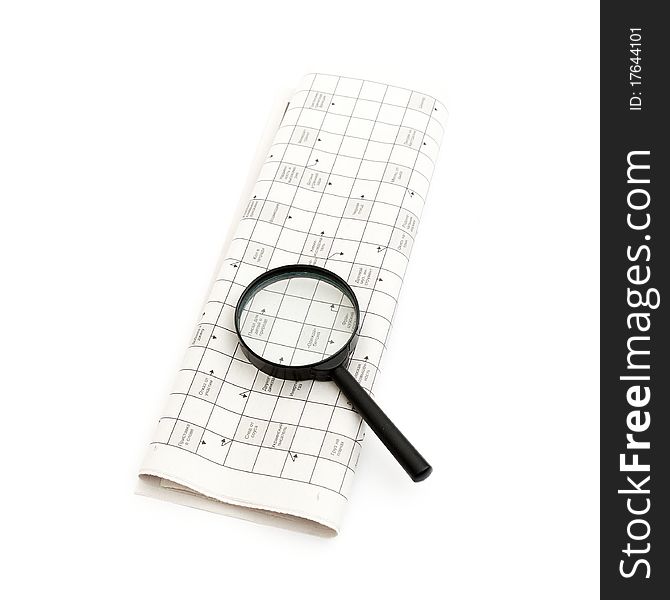 A magnifying glass focusing on a graph in the business section of the newspaper. A magnifying glass focusing on a graph in the business section of the newspaper.