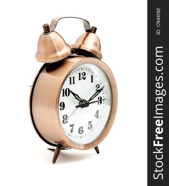 Bronze vintage alarm clock isolated on white background