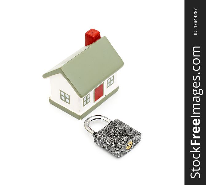 Miniature house with lock isolated on white