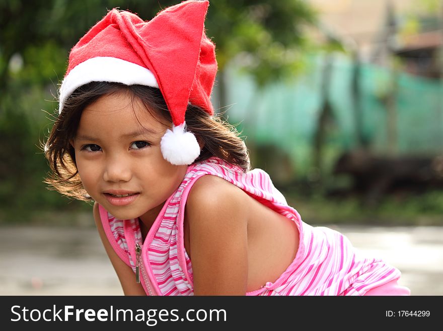 Young girl wearing Santa hat. Young girl wearing Santa hat