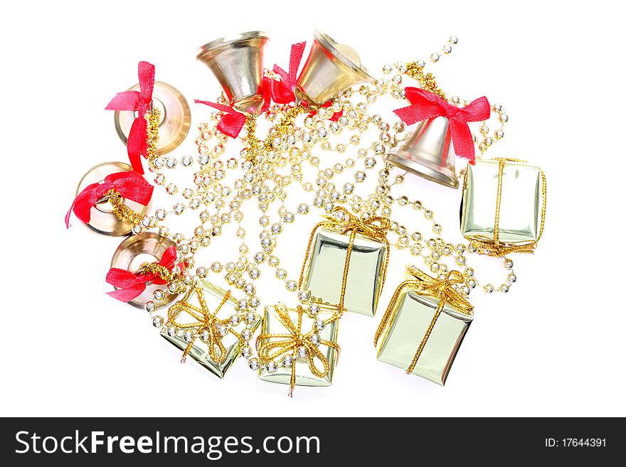 Gift boxes and bells on a white. Gift boxes and bells on a white