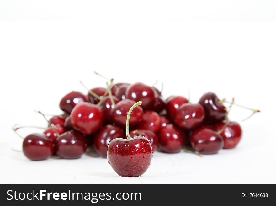 Fresh red cherry isolated on white