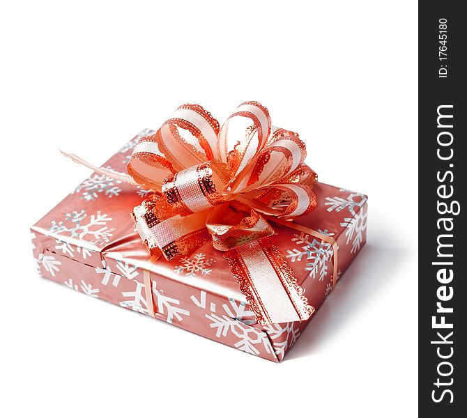 Red box tied with a ribbon-bow on white background. Red box tied with a ribbon-bow on white background