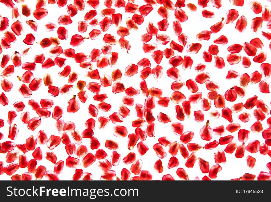 Pomegranate seeds isolated on white