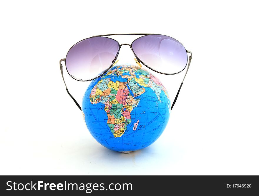 Globe With Sunglasses Isolated On The White