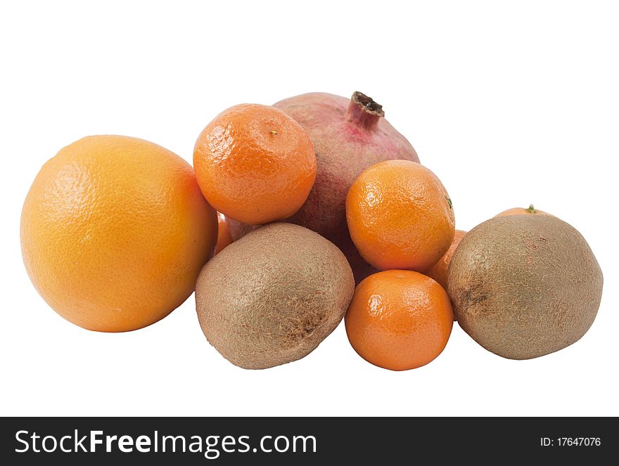 Pomegranate, kiwi, tangerines and oranges on a white background