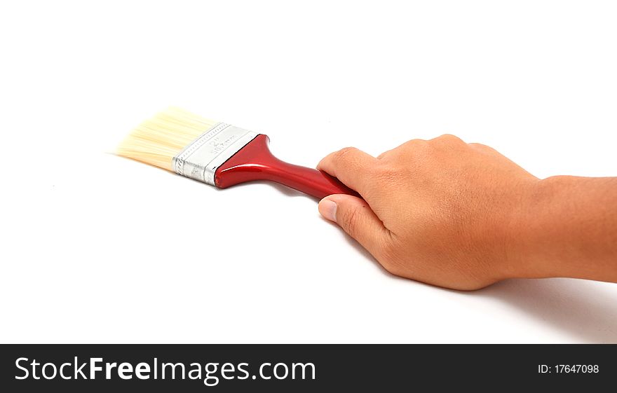 Female hand with paintbrush isolated over white. Female hand with paintbrush isolated over white