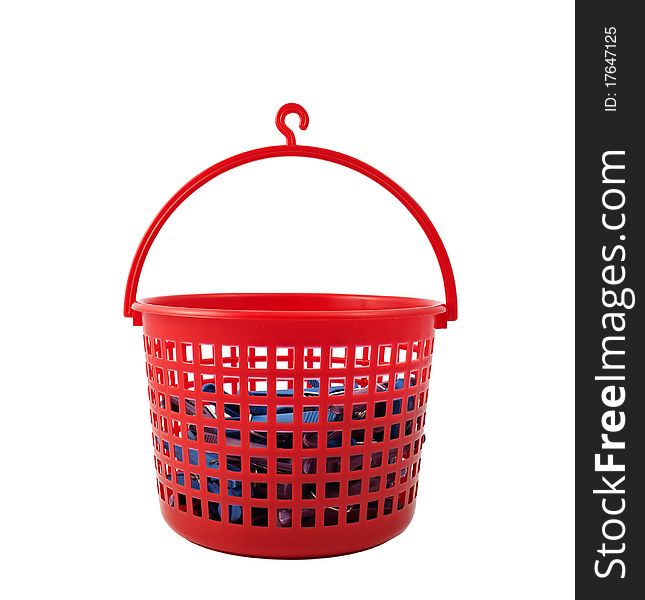 Basket with clothespins on a white background