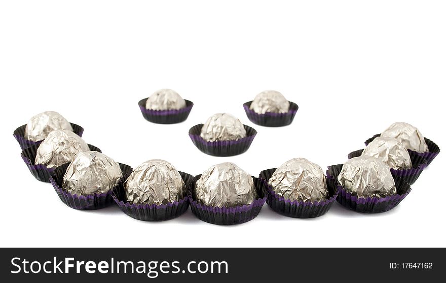 Chocolate candy wrapped in a white background