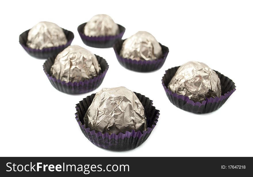 Chocolate candy wrapped in a white background