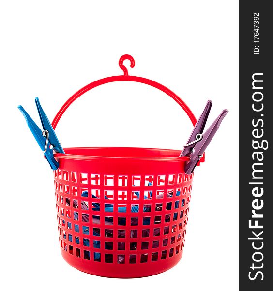 Basket with clothespins on a white background