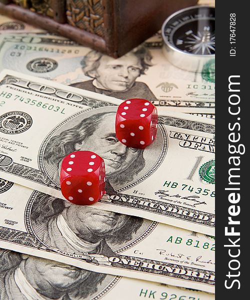 Red dices and compass on dollars