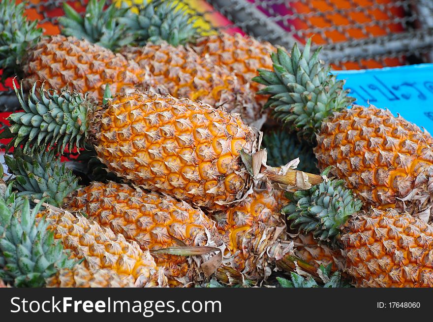 Pineapple on the market, used to background