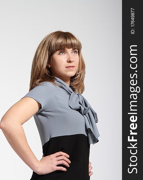 Young business woman in grey and black dress